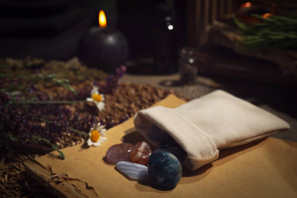 istock Bag with gemstones and healing herbs on table 1350587297