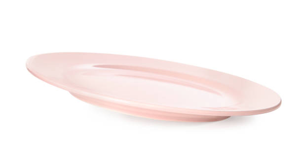 istock Clean light pink plate isolated on white 1350587320
