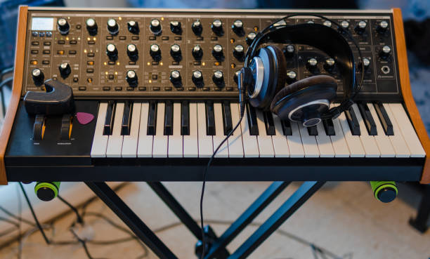 istock Synthesizer, ebow, guitar pick and headphones. 1350588954