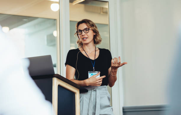 istock Businesswoman delivering a speech during a conference 1350592933
