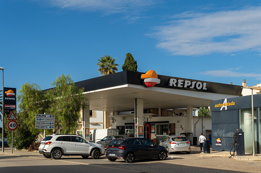 Santanyi, Spain; october 23 2021: Gas station of the multinational company Repsol, with cars refueling. Santanyi, island of Mallorca, Spain