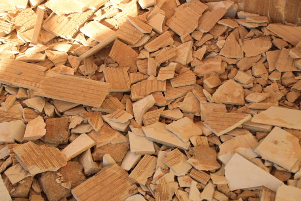 istock Tile remnants stored as construction rubble in a container for collection 1350595900