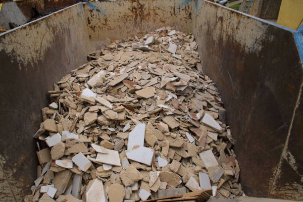 istock Tile remnants stored as construction rubble in a container for collection 1350595928