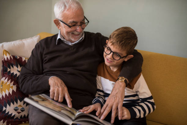 istock Grandpa homeschooling his grandson 1350597852