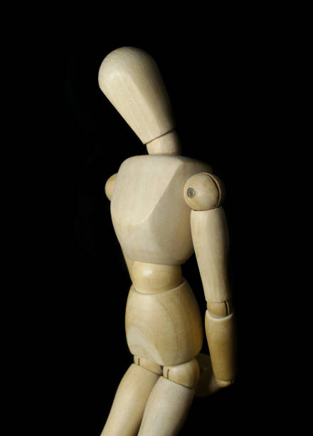 istock Wooden figurine isolated on black background 1350602133
