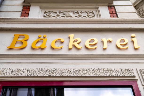 Höxter, Nordrhein-Westfalen-Germany - 04-04-2021:Golden letters on a classic tasteful facade, writing in German the word bakery above a store, which is a bakery.