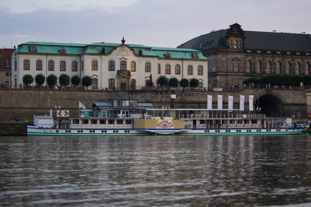 The paddle steamer "Meissen" of the "Weiße Flotte" on the Elbe Dresden, Germany - August 12 2021: The paddle steamer PD Meissen of the Sächsische Dampfschifffahrt on the river Elbe in Dresden. Dresden has the oldest fleet of active paddle steamers in the world. flotte stock pictures, royalty-free photos & images