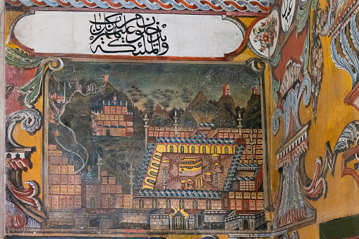 Tetovo, North Macedonia - August 20, 2021: Depiction of Mecca Holy city on the interior wall of ancient 1495 painted Pasha Mosque