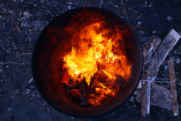 istock top view of an orange flame in an old iron barrel 1350604077
