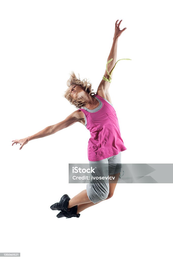 Celebrating Life Young woman jumping high with arms spread wide High Up Stock Photo