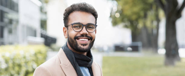 istock Handsome young man wearing warm clothing looking at camera, banner 1350606150