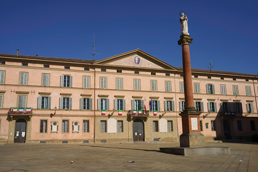 Castel San Pietro Terme, Italy - June 2, 2021: Castel San Pietro Terme, in Bologna province, Emilia-Romagna, Italy: main square of the historic city with the town hall