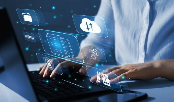 istock Business woman using a laptop with digital graph to document management. Software online documentation database and digital file storage system and file access concept.Enterprise resource planning. 1350606702