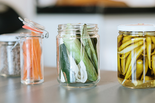 Different jars with food and vegetable leftovers / peels - Sustainabiliy and upcycling concept