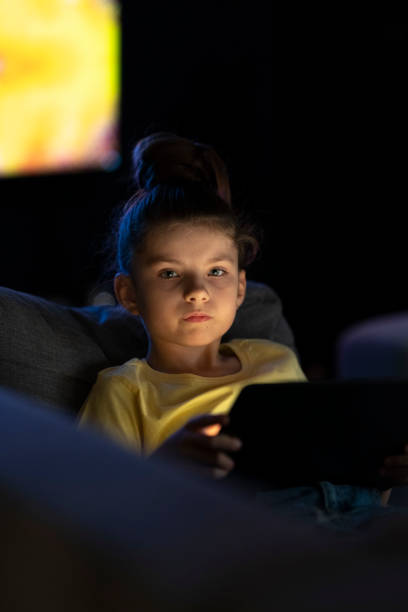 istock Focused girl using digital tablet at home_002_04 1350611164