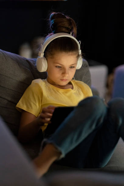 istock Focused girl using digital tablet at home_002_08 1350611265