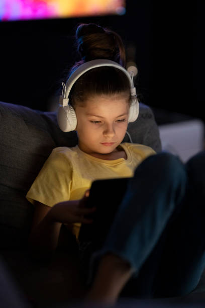 istock Focused girl using digital tablet at home_002_09 1350611288