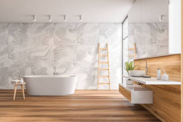 istock Side view on bright bathroom interior with bathtub 1350614078