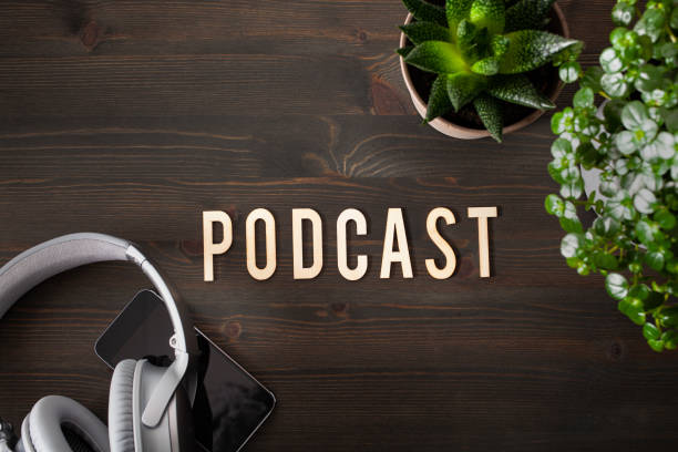 istock podcast word text concept modern wireless headphones smartphone 1350617207