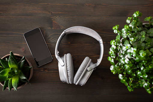 aaudiobook music concept modern wireless headphones smartphone book