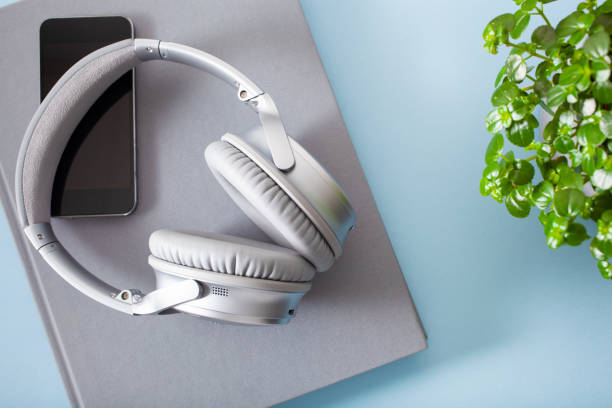 istock audiobook concept modern wireless headphones smartphone book 1350617265