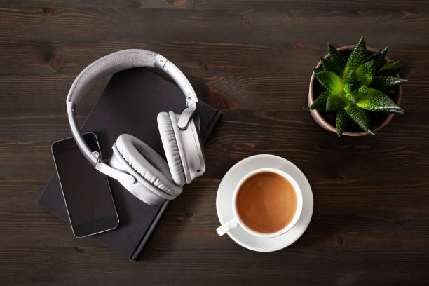 istock audiobook concept modern wireless headphones smartphone book 1350617282