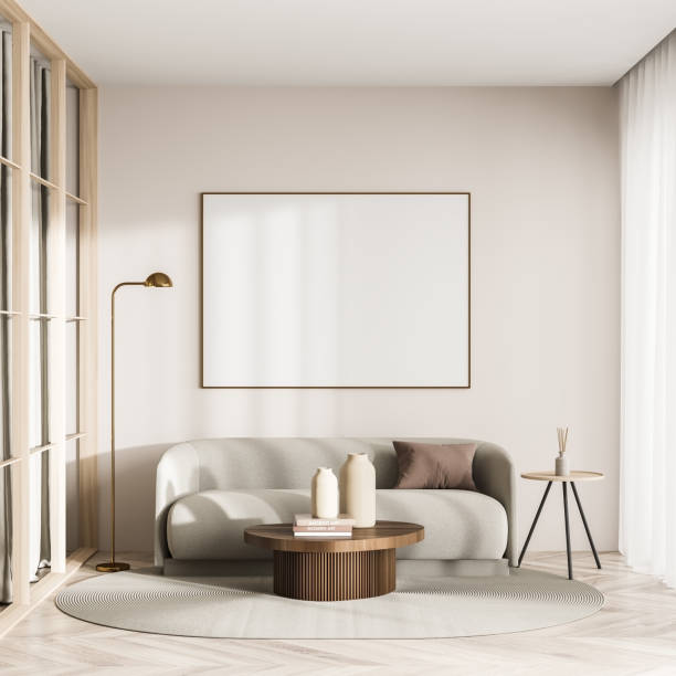 istock Bright living room interior with white empty poster, couch 1350619156
