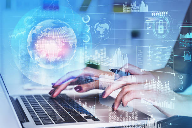 istock Businesswoman is typing message on laptop with digital interface 1350619231