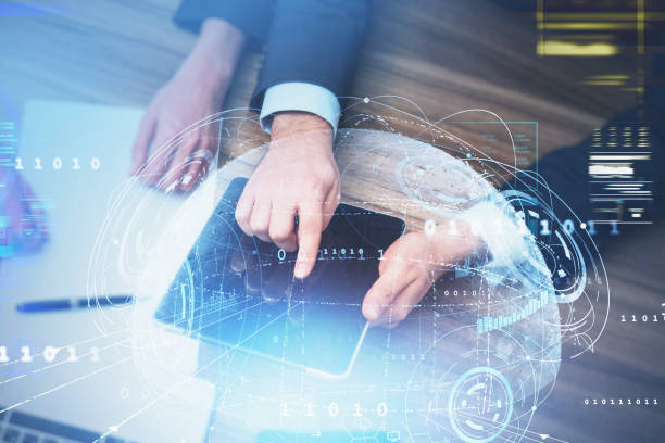 istock Businessman in formal suit is touching tablet with his finger 1350620015