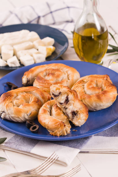 istock Pastry swirls with cheese and olive filling. 1350621563