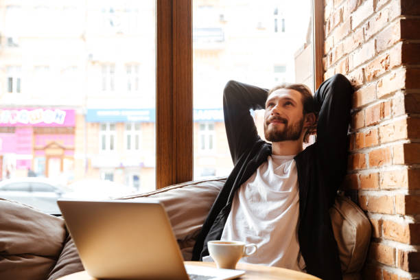 istock Bearded man in cafe near the window 1350621799