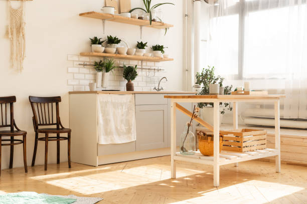 istock Stylish scandinavian open space with kitchen accessories and plants. 1350626210