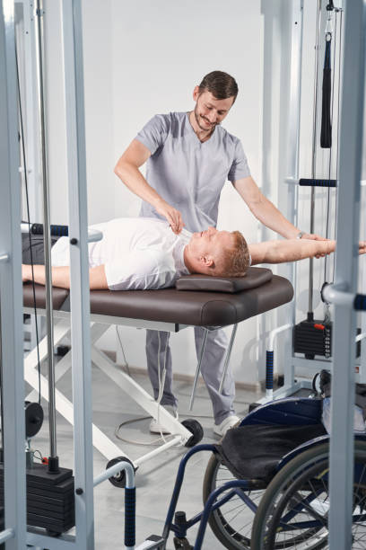 istock Chiropractor treats shoulder joint mobility of man on massage table 1350626243