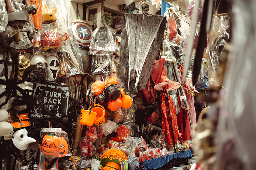 BANGKOK, THAILAND - October 25, 2021: Halloween decorations and costumes prominently displayed at Sampheng market during the Halloween holidays.