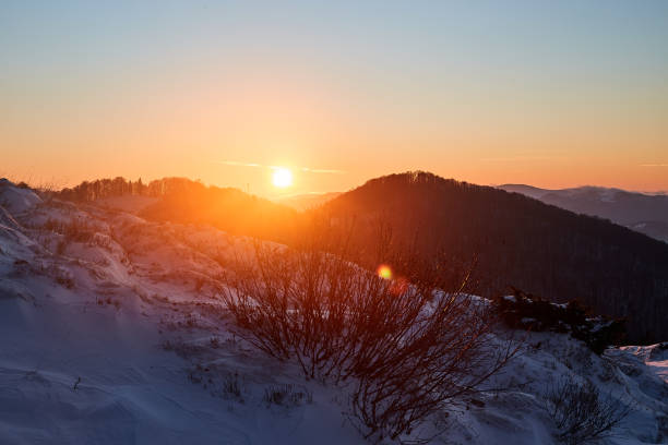 istock Winter sunset landscape in snowy mountaines 1350626606