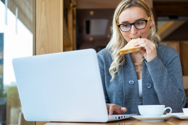 istock Businesswoman having lunch 1350626637
