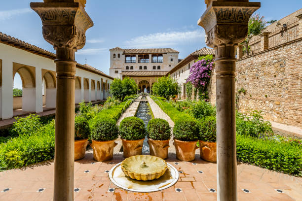 istock Generalife palace with green courtyard in Alhambra, Granada, Spain 1350628233
