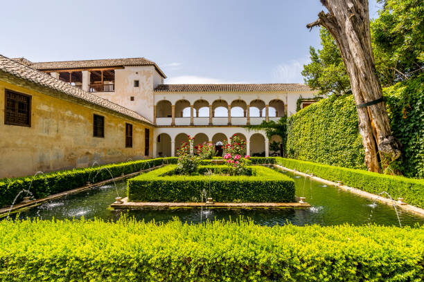 istock Generalife palace with green courtyard in Alhambra, Granada, Spain 1350628251