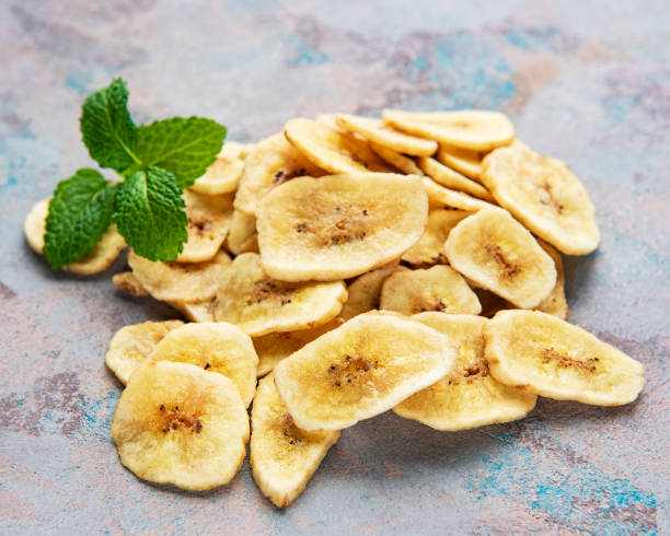 istock Dried candied banana slices or chips 1350630702