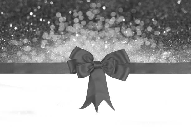 Glitter illuminates abstract background. Defocused bokeh dark