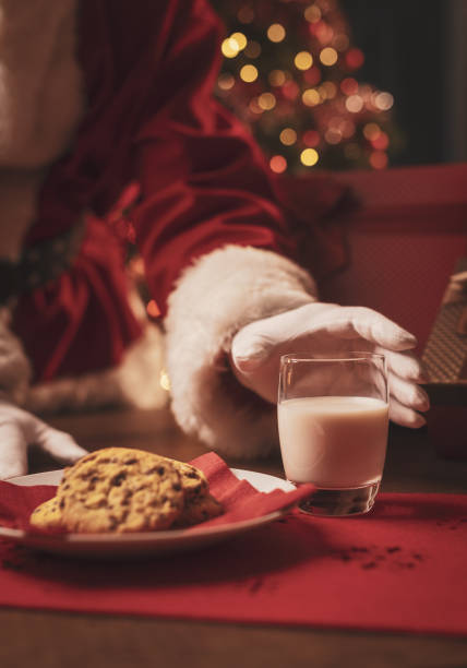 istock Santa Claus having a delicious snack 1350632065