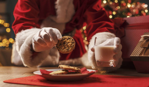istock Santa Claus having a delicious snack 1350632593