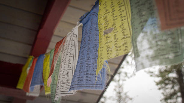 istock Buddhist prayer flags wave in the breeze on a sunny mountainside 1350633907