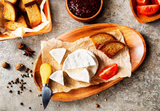 istock Camembert cheese. Round brie or camambert cheese. Selective focus 1350634307
