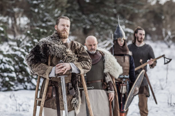 istock Viking warriors in a snow filled forest 1350634368