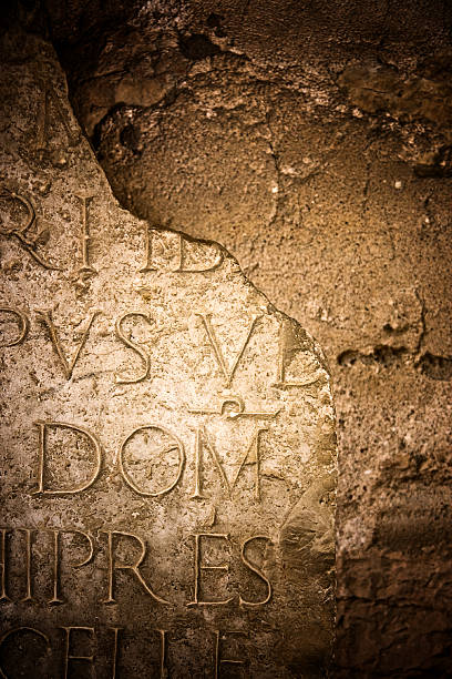 istock Ancient Latin Inscription Broken Stone 135063460