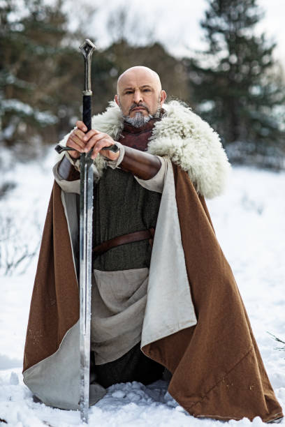 istock Viking warrior king in a snowy forest 1350634712