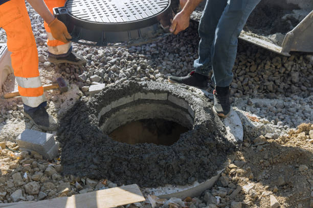 istock Construction of sewerage installing a sewer manhole on septic tank 1350635628