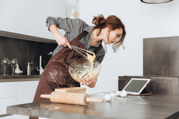 istock Incredible lady cooking the dough 1350635852
