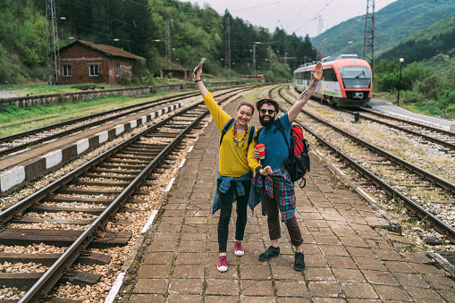 Couple of tourists arriving by train